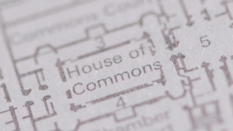 Close-Up-On-Page-Of-Book-Or-Encyclopaedia-With-Plan-Showing-House-Of-Commons-In-London-UK