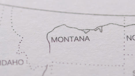 Close-Up-On-Page-Of-Atlas-Or-Encyclopaedia-With-USA-Map-Showing-State-Of-Montana
