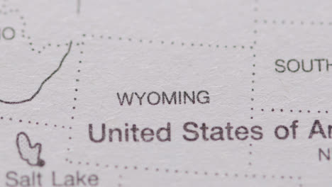 Close-Up-On-Page-Of-Atlas-Or-Encyclopaedia-With-USA-Map-Showing-State-Of-Wyoming