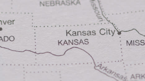 Close-Up-On-Page-Of-Atlas-Or-Encyclopaedia-With-USA-Map-Showing-State-Of-Kansas