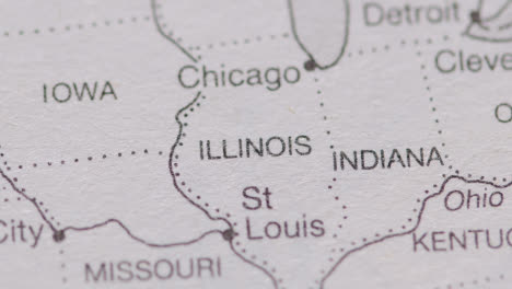 Close-Up-On-Page-Of-Atlas-Or-Encyclopaedia-With-USA-Map-Showing-State-Of-Illinois,-Indiana-and-Idaho