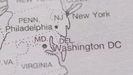 Close-Up-On-Page-Of-Atlas-Or-Encyclopaedia-With-USA-Map-Showing-State-Of-Washington-DC-1