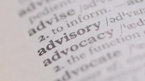 Close-Up-On-Page-Of-Dictionary-With-Definition-Of-Word-Advisory