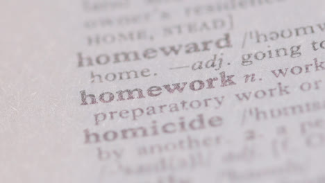 Close-Up-On-Page-Of-Dictionary-With-Definition-Of-Word-Homework