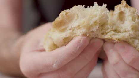 Close-Up-Studio-Shot-Of-Person-Tearing-Open-Fresh-Bread-Roll-2