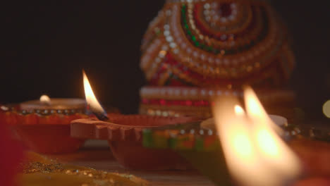 Close-Up-Of-Burning-Lamps-And-Decorations-Celebrating-Festival-Of-Diwali