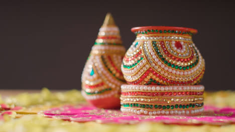 Traditional-Coconut-Pots-On-Table-Decorated-For-Celebrating-Festival-Of-Diwali