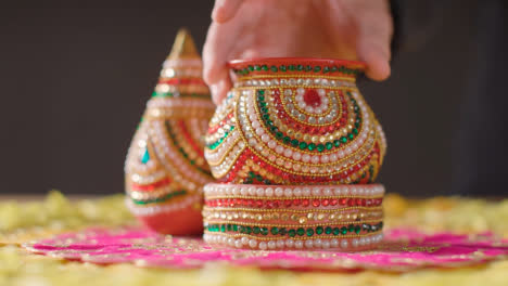 Traditional-Coconut-Pots-On-Table-Decorated-For-Celebrating-Festival-Of-Diwali-1