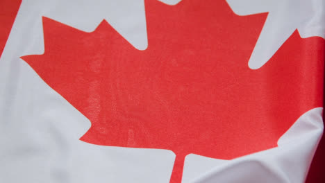 Close-Up-Studio-Shot-Of-Canadian-Flag-Filling-Frame