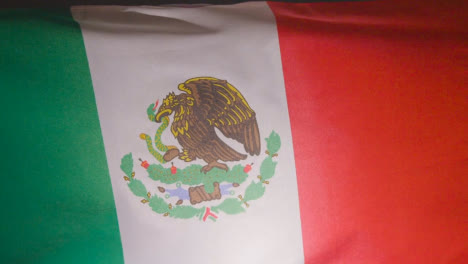 Close-Up-Studio-Shot-Of-Mexican-Flag-Flying-Filling-Frame