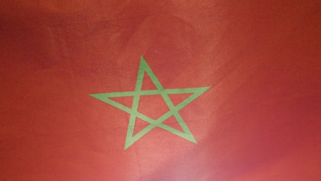 Close-Up-Studio-Shot-Of-Moroccan-Flag-Flying-Filling-Frame