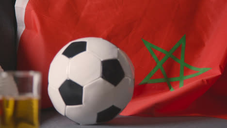 Flag-Of-Morocco-Draped-Over-Sofa-At-Home-With-Football-Ready-For-Match-On-TV-3