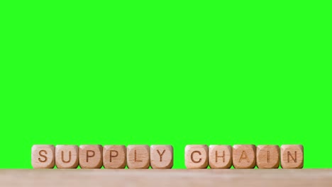 Business-Concept-Wooden-Letter-Cubes-Or-Dice-Spelling-Supply-Chain-Against-Green-Screen