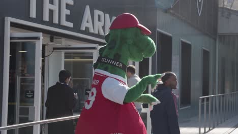 Club-Mascot-Dancing-Outside-The-Emirates-Stadium-Home-Ground-Arsenal-Football-Club-London-With-Supporters-On-Match-Day