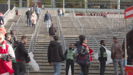 Steps-Outside-The-Emirates-Stadium-Home-Ground-Arsenal-Football-Club-London-With-Supporters-On-Match-Day