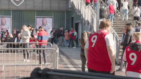 Steps-Outside-The-Emirates-Stadium-Home-Ground-Arsenal-Football-Club-London-With-Supporters-On-Match-Day