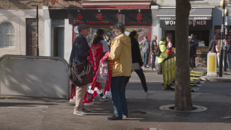 Man-Selling-Club-Merchandise-Outside-The-Emirates-Stadium-Home-Ground-Arsenal-Football-Club-London-With-Supporters-On-Match-Day-1