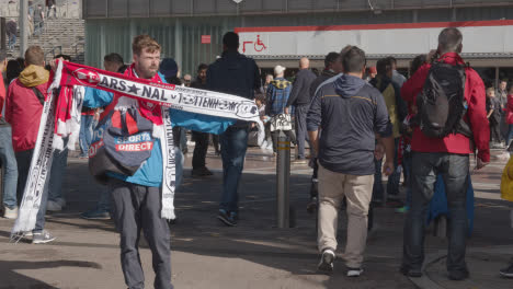 Man-Selling-Club-Merchandise-Outside-The-Emirates-Stadium-Home-Ground-Arsenal-Football-Club-London-With-Supporters-On-Match-Day