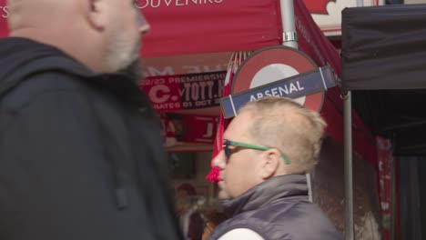 Stall-Selling-Club-Merchandise-Outside-The-Emirates-Stadium-Home-Ground-Arsenal-Football-Club-London-With-Supporters-On-Match-Day-7