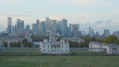 View-Of-Old-Royal-Naval-College-With-City-Skyline-And-River-Thames-Behind-From-Royal-Observatory-In-Greenwich-Park-At-Dusk