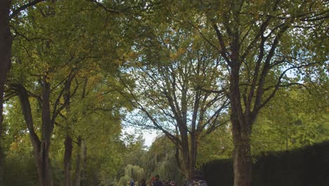 People-Walking-Through-Bute-Park-In-Cardiff-Wales-In-Autumn