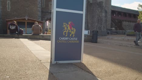 Advertising-Sign-Outside-Cardiff-Castle-With-Tourists