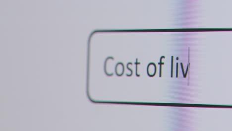 Close-Up-Of-Screen-With-Person-Typing-Cost-Of-Living-Crisis-Into-Computer-Search-Engine-1