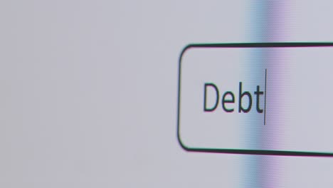 Close-Up-Of-Screen-With-Person-Typing-Debt-Into-Computer-Search-Engine