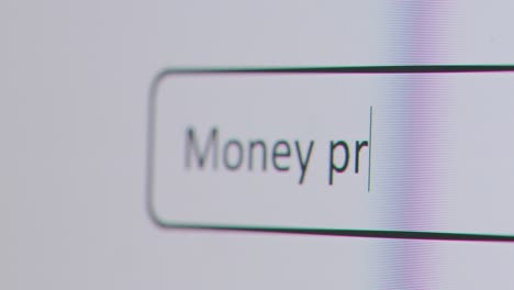 Close-Up-Of-Screen-With-Person-Typing-Money-Problems-Into-Computer-Search-Engine