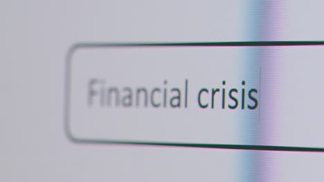 Close-Up-Of-Screen-With-Person-Typing-Financial-Crisis-Into-Computer-Search-Engine