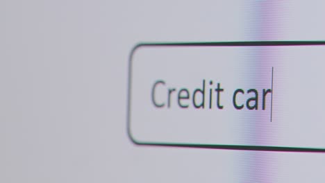 Close-Up-Of-Screen-With-Person-Typing-Credit-Card-Debt-Into-Computer-Search-Engine