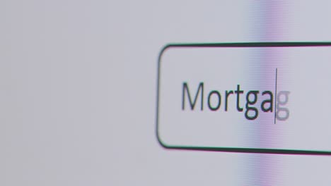 Close-Up-Of-Screen-With-Person-Typing-Mortgage-Rates-Going-Up-Into-Computer-Search-Engine