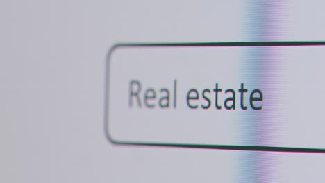 Close-Up-Of-Screen-With-Person-Typing-Real-Estate-Into-Computer-Search-Engine