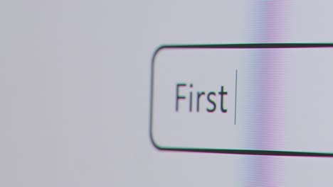Close-Up-Of-Screen-With-Person-Typing-First-Time-Buyer-Into-Computer-Search-Engine
