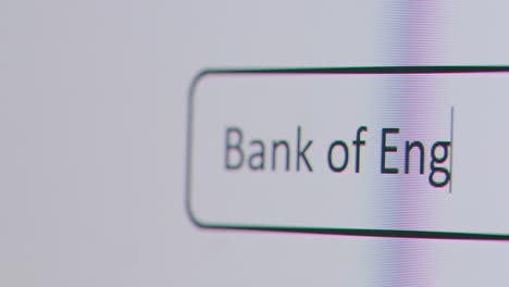 Close-Up-Of-Screen-With-Person-Typing-Bank-Of-England-Interest-Rate-Into-Computer-Search-Engine