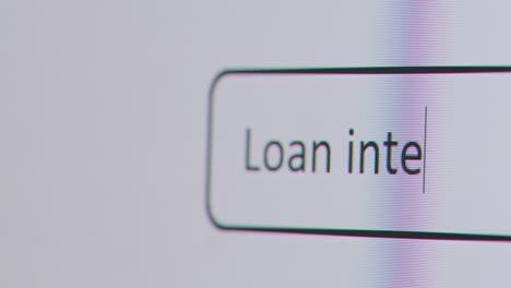 Close-Up-Of-Screen-With-Person-Typing-Loan-Interest-Rates-Into-Computer-Search-Engine