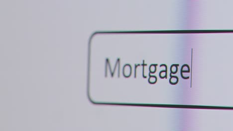 Close-Up-Of-Screen-With-Person-Typing-Mortgage-Broker-Into-Computer-Search-Engine