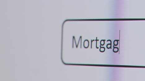 Close-Up-Of-Screen-With-Person-Typing-Mortgage-Advisor-Into-Computer-Search-Engine