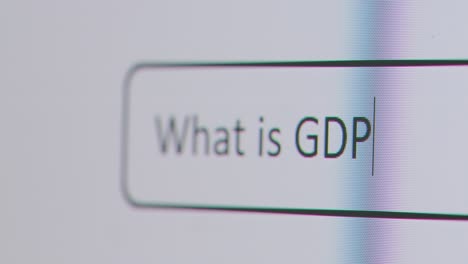 Close-Up-Of-Screen-With-Person-Typing-What-Is-GDP-Into-Computer-Search-Engine-1