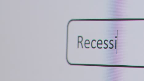Close-Up-Of-Screen-With-Person-Typing-Recession-Versus-Depression-Into-Computer-Search-Engine