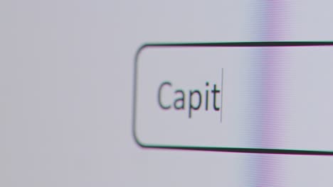 Close-Up-Of-Screen-With-Person-Typing-Capital-Investment-Into-Computer-Search-Engine