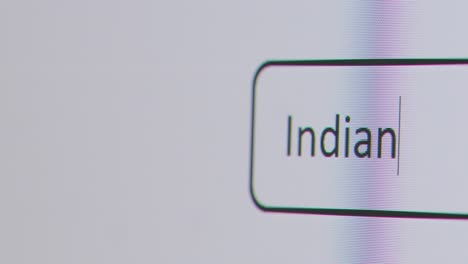 Close-Up-Of-Screen-With-Person-Typing-Indian-Rupee-Currency-Into-Computer-Search-Engine