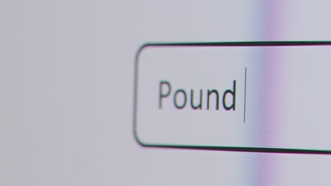 Close-Up-Of-Screen-With-Person-Typing-Pound-To-Dollar-Into-Computer-Search-Engine