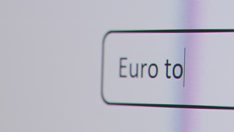 Close-Up-Of-Screen-With-Person-Typing-Euro-To-Pound-Sterling-Into-Computer-Search-Engine