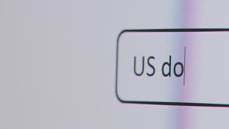 Close-Up-Of-Screen-With-Person-Typing-US-Dollar-Currency-Into-Computer-Search-Engine
