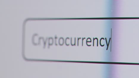 Close-Up-Of-Screen-With-Person-Typing-Cryptocurrency-Into-Computer-Search-Engine