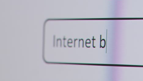 Close-Up-Of-Screen-With-Person-Typing-Internet-Banking-Into-Computer-Search-Engine