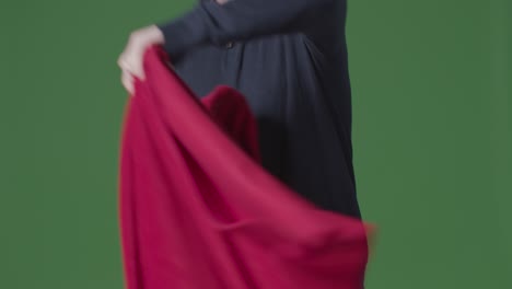 Close-Up-Of-Person-Wearing-Blanket-Trying-To-Keep-Warm-In-Energy-Crisis-Against-Green-Screen