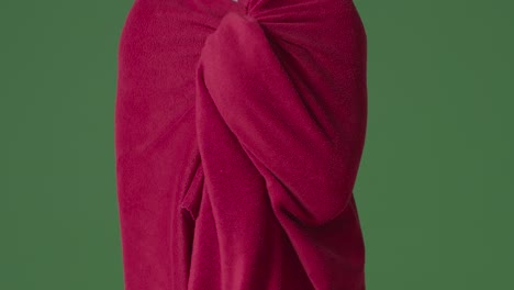 Close-Up-Of-Person-Wearing-Blanket-Trying-To-Keep-Warm-In-Energy-Crisis-Against-Green-Screen-1
