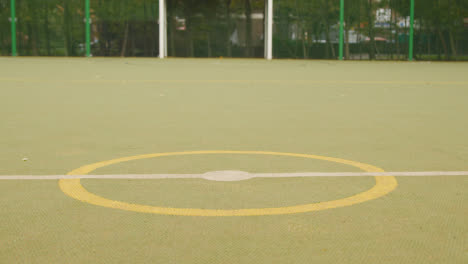 View-Of-Goal-On-Empty-Artificial-Soccer-Pitch-In-Urban-City-Area-3